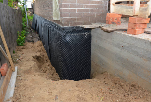 SJ Waterproofing Pros technician performing targeted Interior Drainage System assessment in Haddonfield, NJ